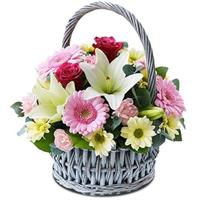 Basket with lilies, roses, gerberas and chrysanthemums