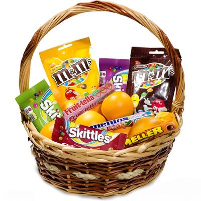 Basket with oranges and sweets Basket with oranges and sweets