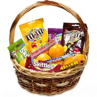 Basket with oranges and sweets Basket with oranges and sweets