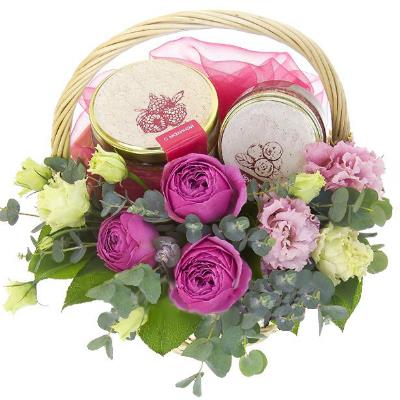 Basket with bush rose, eustoma and jam Basket with bush rose, eustoma and jam