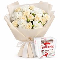 A bouquet of spray roses, dianthus, and Raffaello.