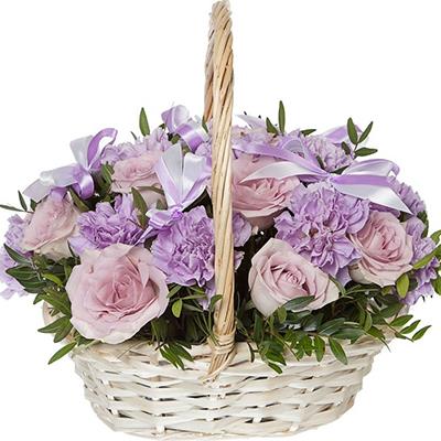 Basket of lilac roses and carnations Basket of lilac roses and carnations