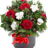 Christmas composition of roses and cotton in a box Christmas composition of roses and cotton in a box