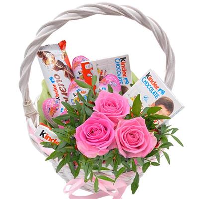 Small gift basket with sweets and flowers  Small gift basket with sweets and flowers