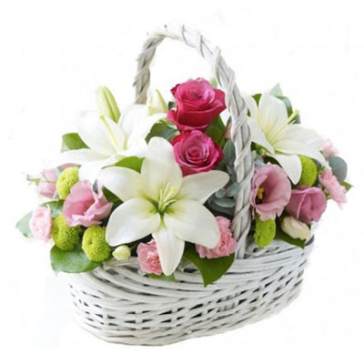 Bouquet of lilies, bush roses, eustoma, chrysanthemums in basket Bouquet of lilies, bush roses, eustoma, chrysanthemums in basket
